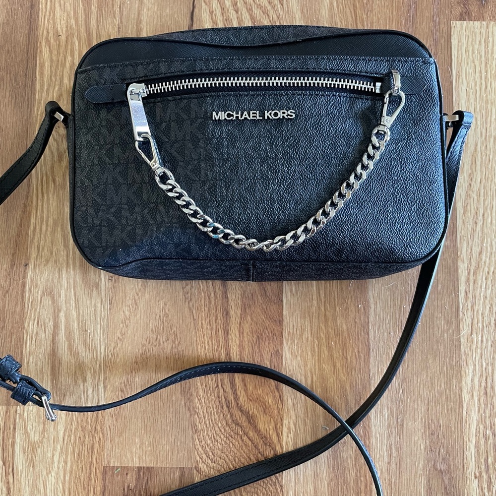 Black Michael Kors cross body purse.